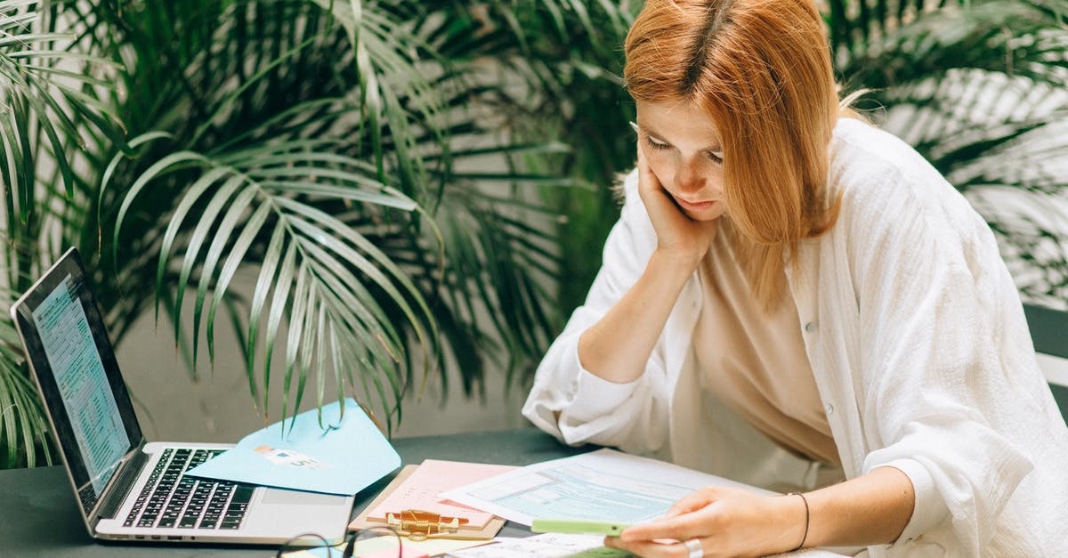 Going to France and Italy - what payment forms are preferred? - A Woman using a Smartphone