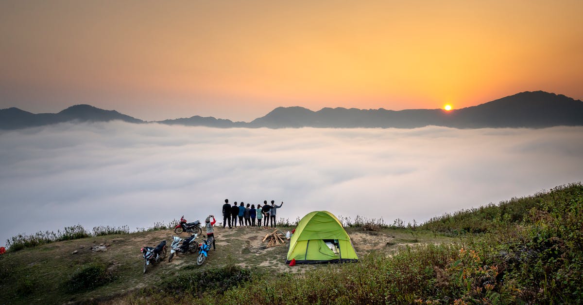 Good mountains to camp on in Japan - People Standing on Cliff Looking at Sea of Clouds