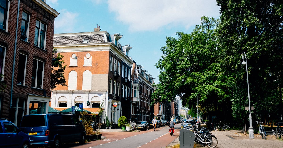 Good route for a 1-day bike trip around Amsterdam - Bicycle lane on asphalt road of residential district