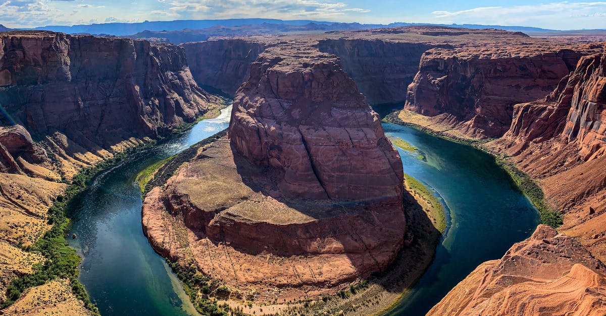 Grand Canyon Skywalk - details on access - Brown Rock Formation Near Body of Water