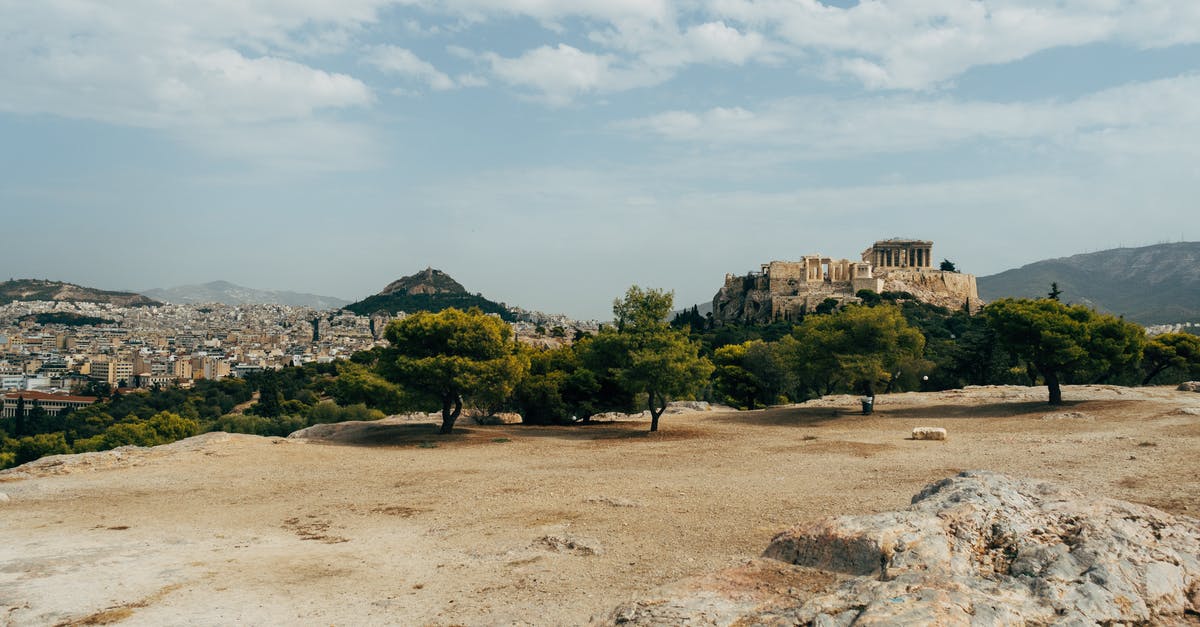 Greece visa rejection [duplicate] - Brown Concrete Building Near Green Trees Under White Clouds