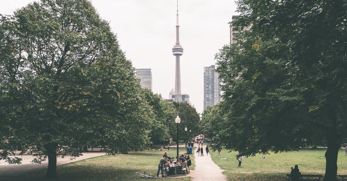 H1B Visa holder travel to Niagara Passing through Canada Via Road - People Walking on Park Near Tower