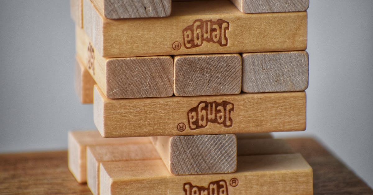 Had eTAs and Passports but Still Denied Boarding Without Explanation [closed] - Closeup of wooden blocks placed on top of each other for playing board game