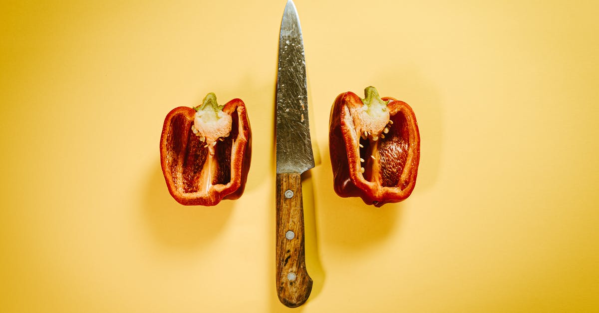 Half an hour layover in Vienna between international flights - Cut red bell pepper with knife on surface