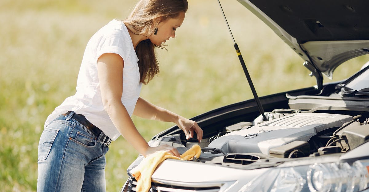 Hard-case suitcase, that doesn't open at the side - Troubled young woman near broken automobile in countryside during car accident