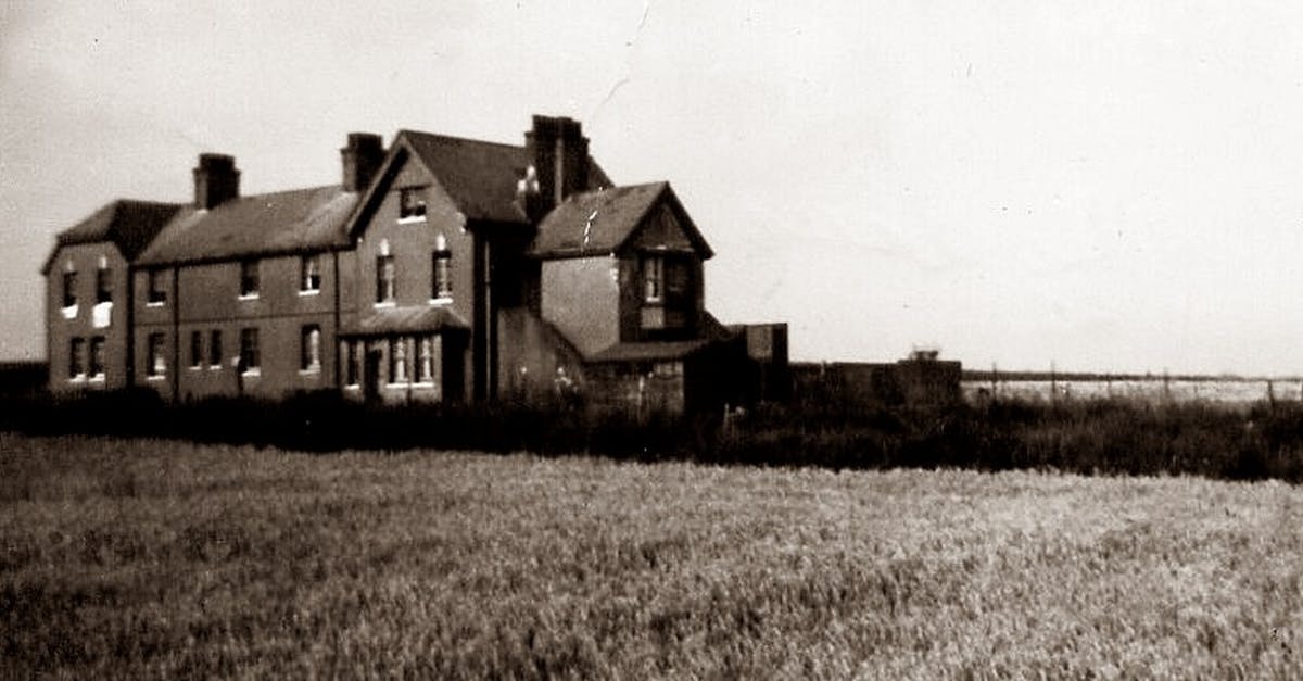 Haunted house in Gdansk - what is the exact address? - Grayscale Photo of House on Grass Field