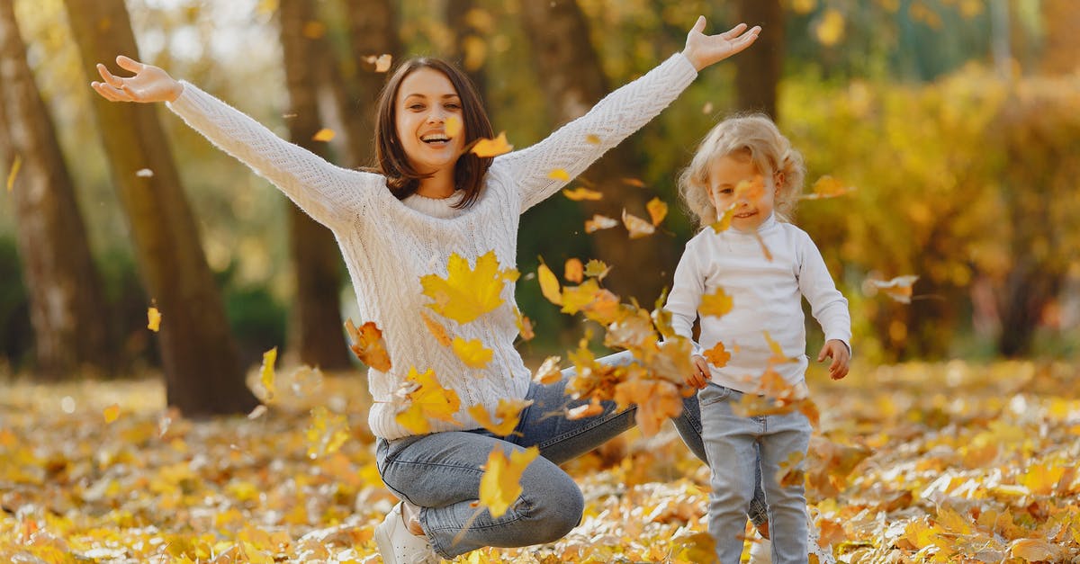 Have I been “Required to leave the UK”? - Playful mother and daughter having fun in autumn park