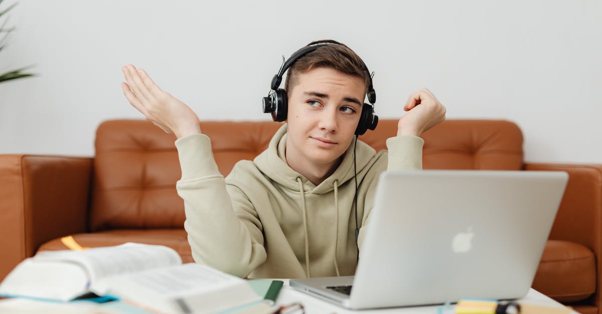 Headphone sockets on Virgin Atlantic Upper Class - Man in Hoodie Sweater Using a Laptop