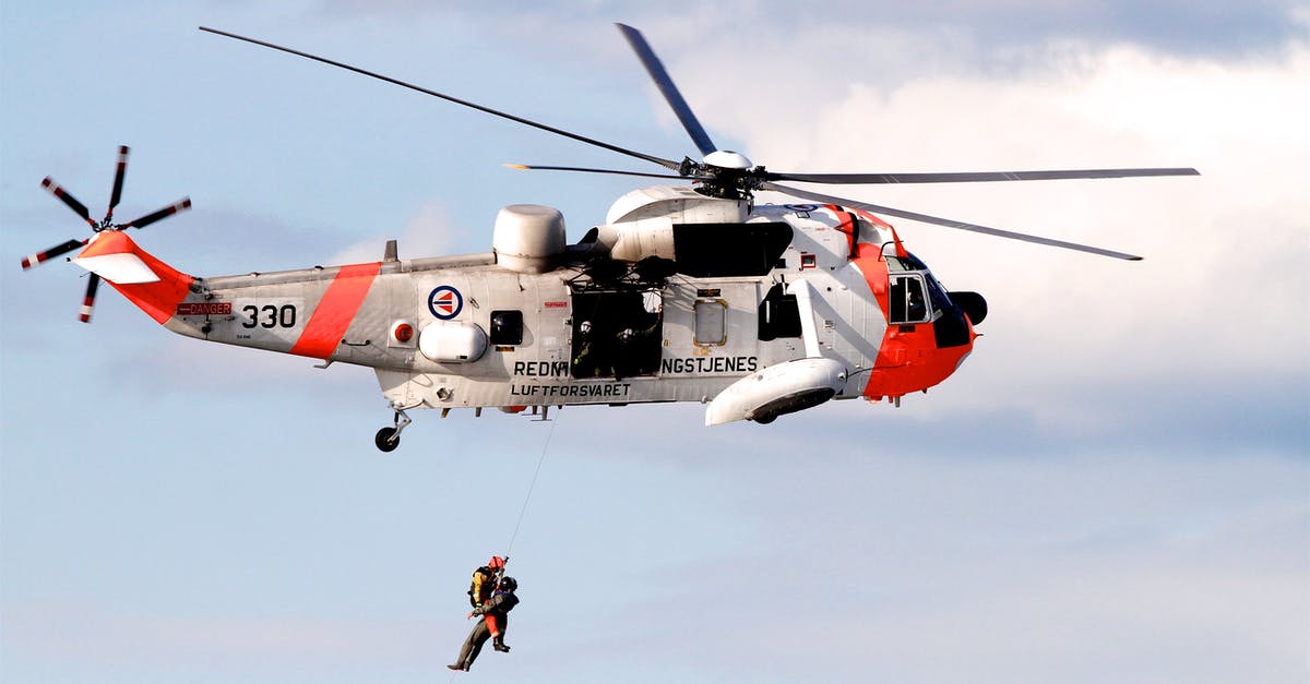 Help for Air Canada Fare Calculation Example - Person Showing White and Orange Helicopter