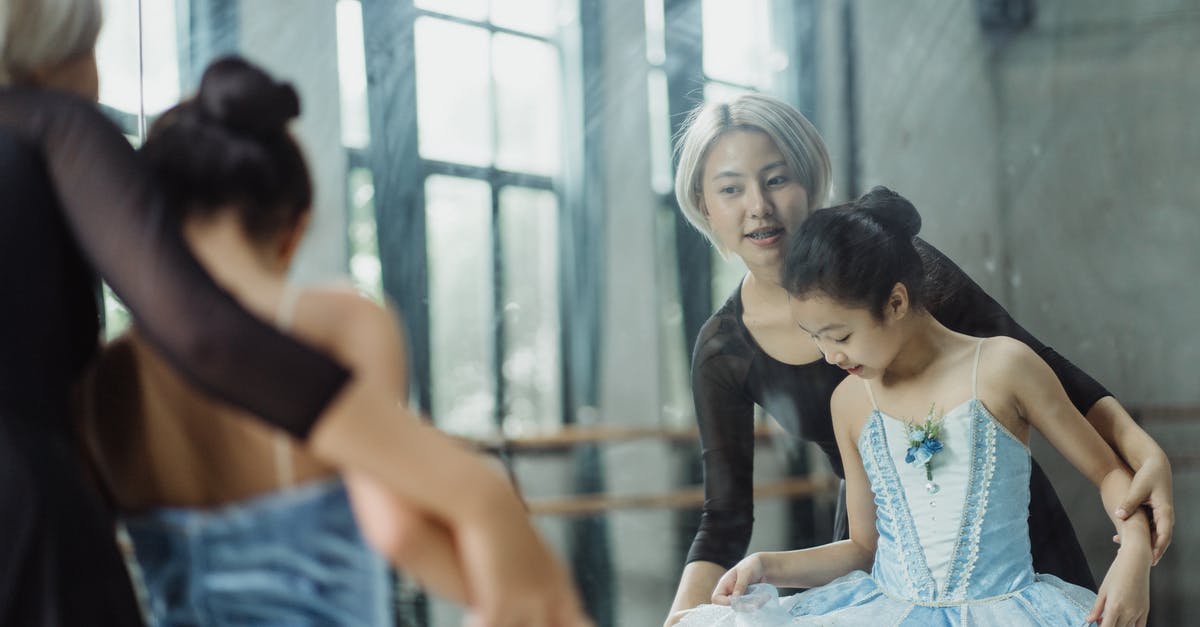 Herding lessons / sheepdog training classes in Japan? [closed] - Professional ethnic ballerina teaching pupil ballet in dance room of school while looking at reflection in mirror