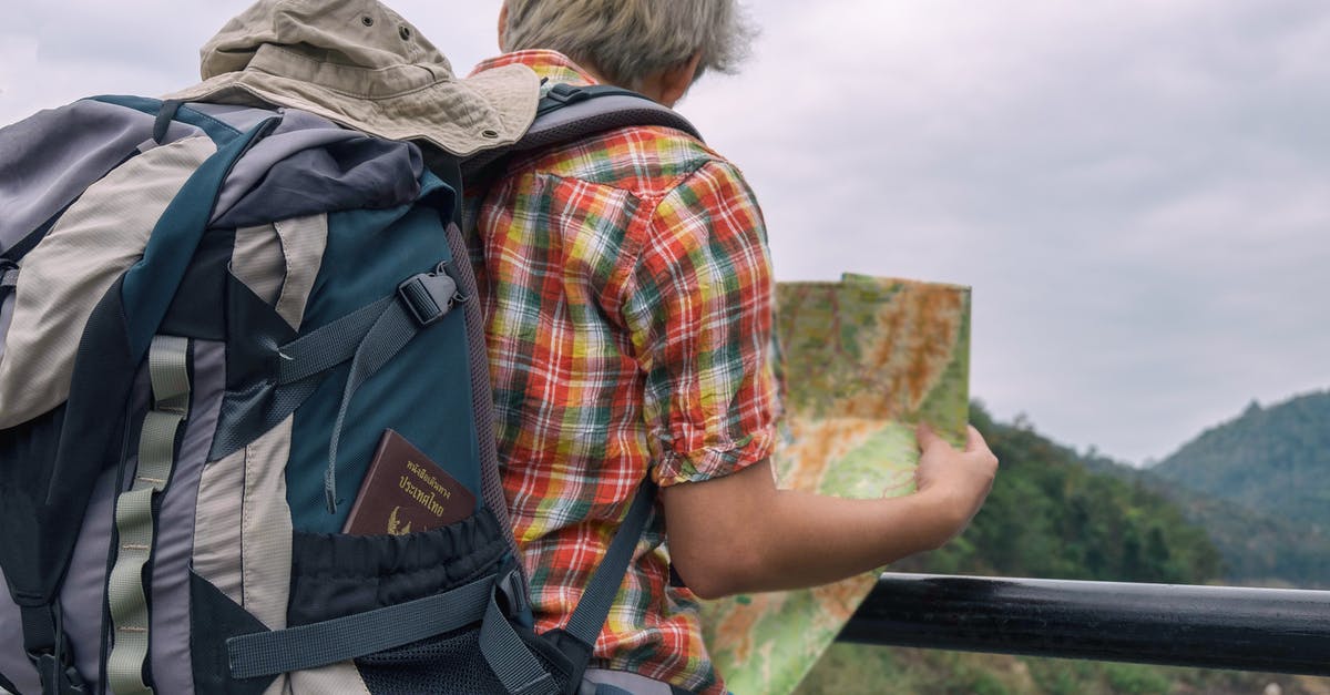 Hiking map for Hokkaido and/or other resources - Man Holding Green and Brown Map