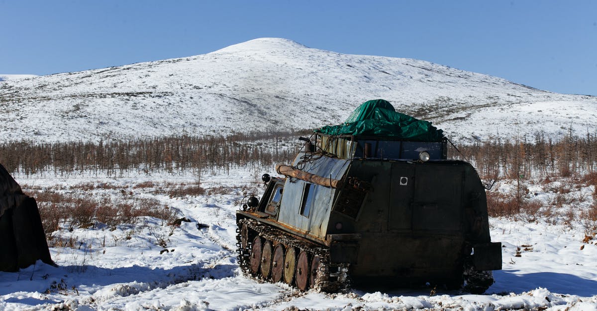 Hiking Mount Fuji in the off season - Vehicle on snowy ground in mountainous area