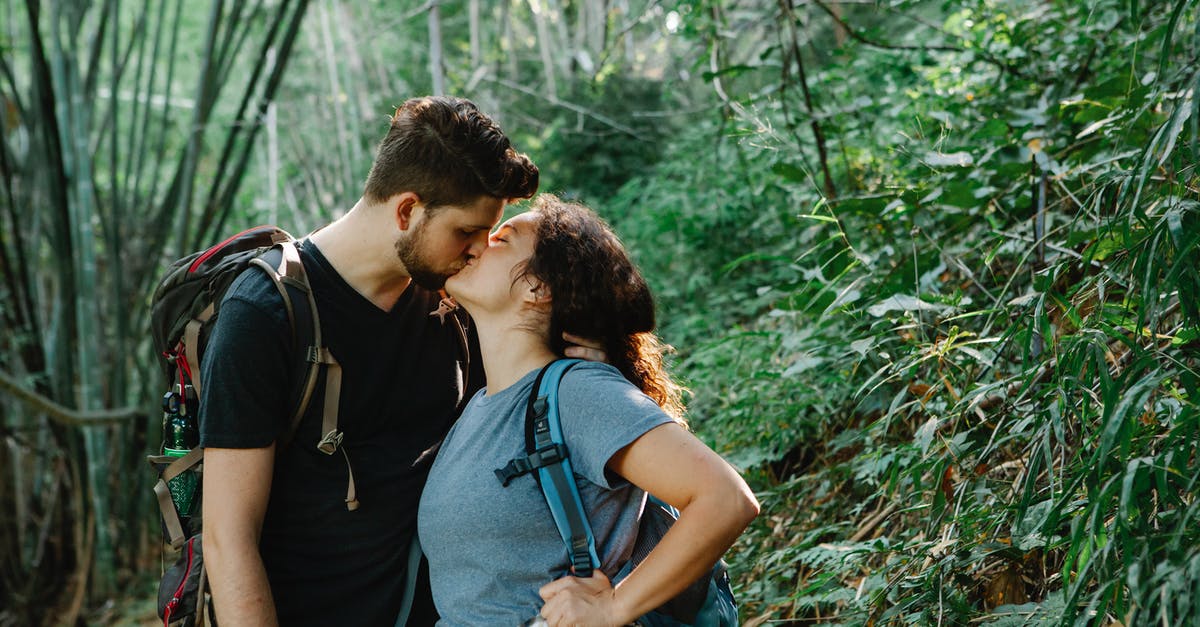 hiking trails near by Salzburg and Linz [closed] - Romantic young couple kissing in forest during trekking