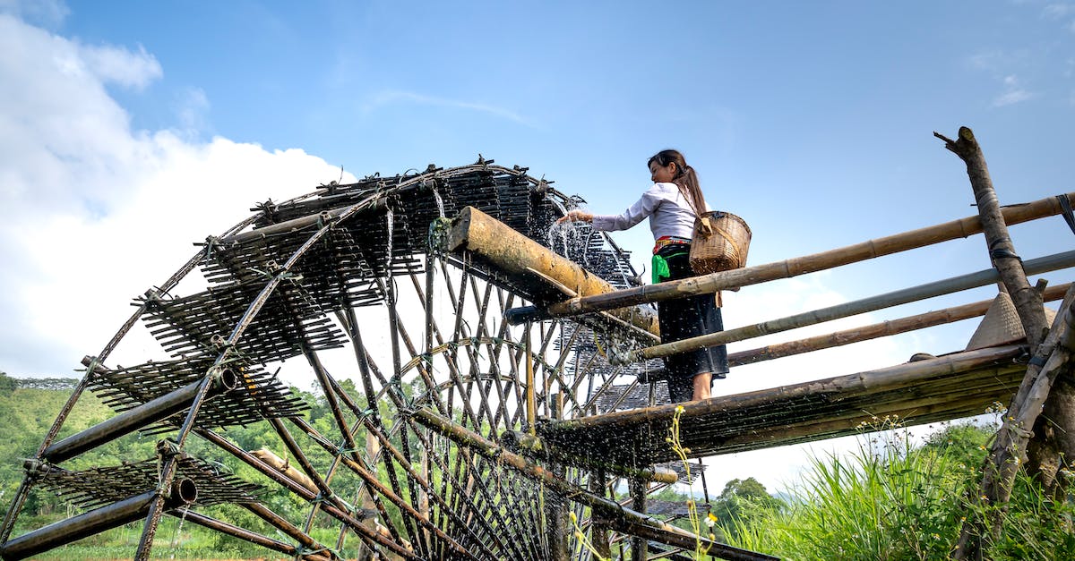 Historic Boston Sites - Good Resource - Woman standing near old water wheel