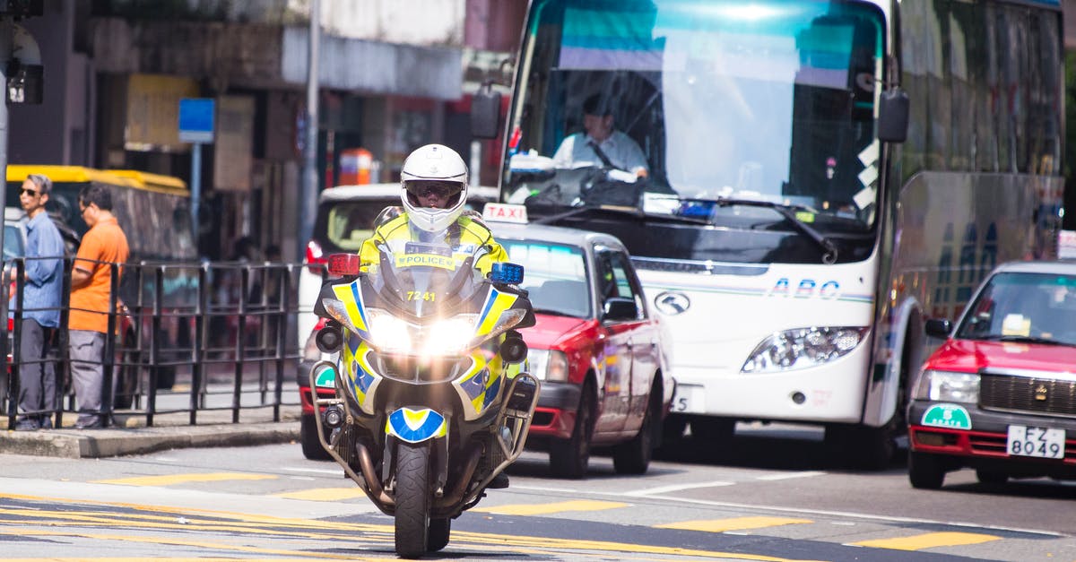 Hong Kong Airport Express Shuttle bus - Police Motorcycle in Middle of Road