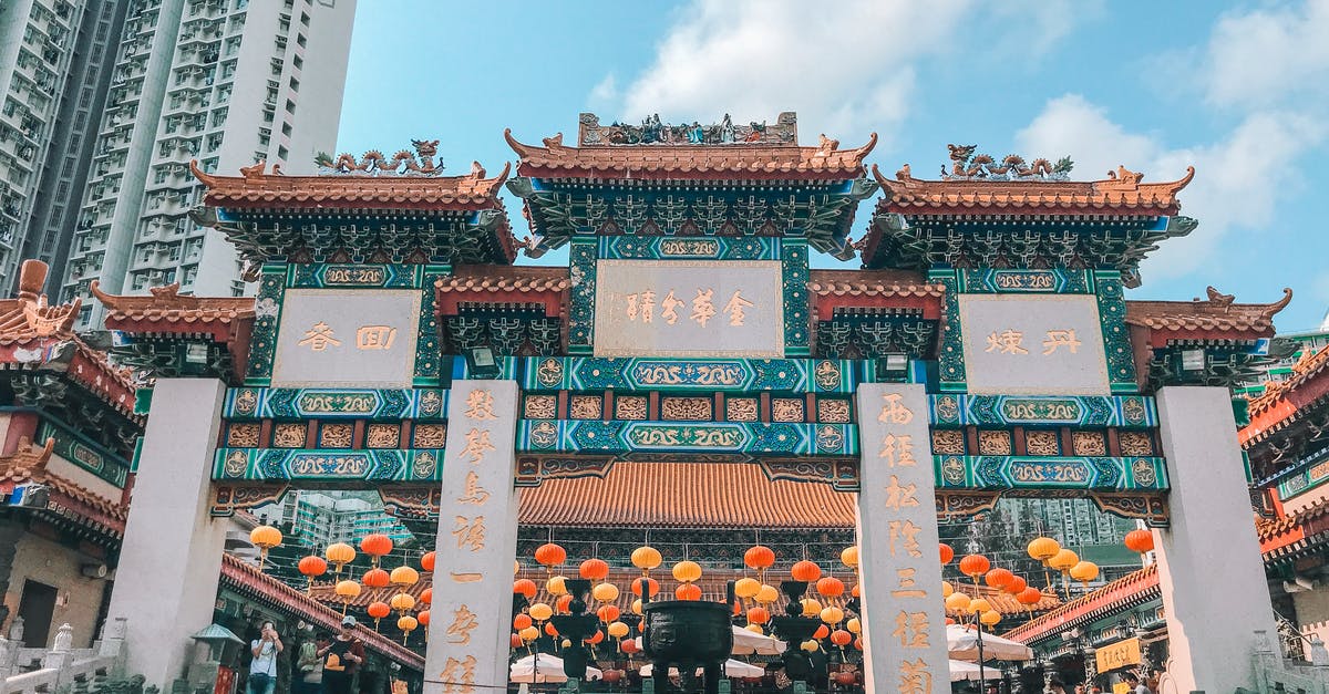 Hong Kong Airport – Macau – Hong Kong - People Walking on Street Near Red and Green Chinese Temple