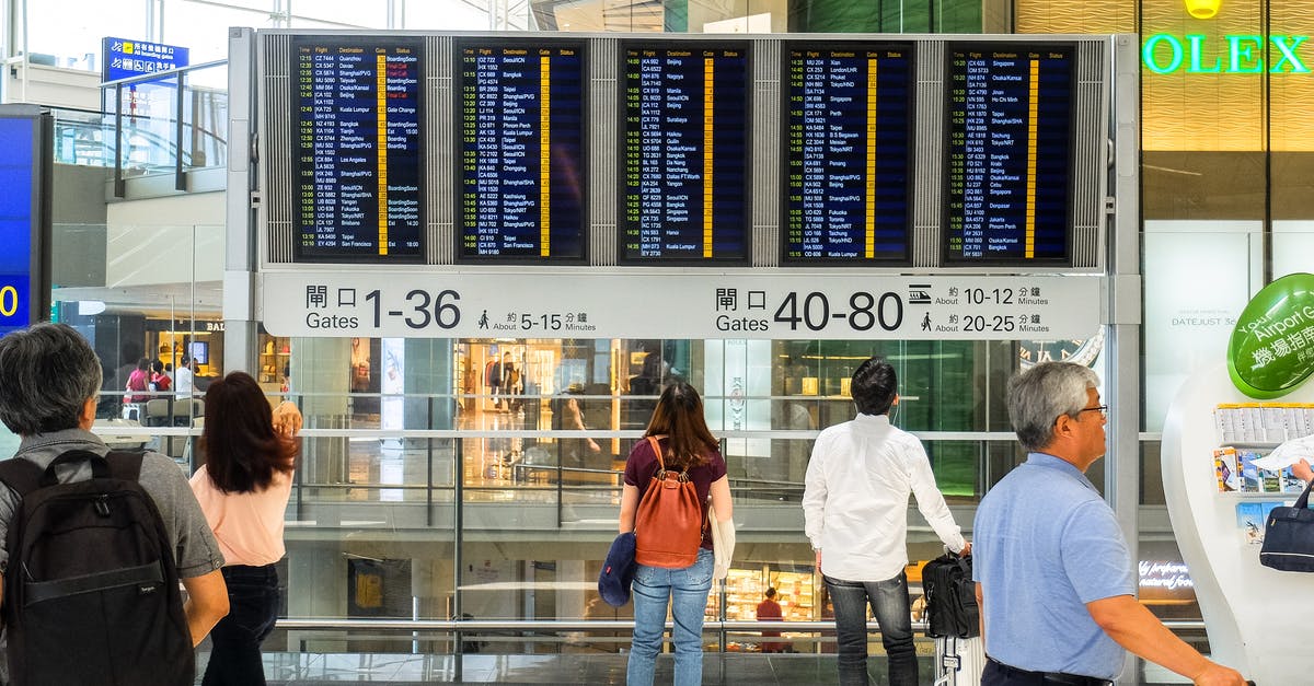 Hong Kong Airport – Macau – Hong Kong - Airport Departure Board at Hong Kong Airport