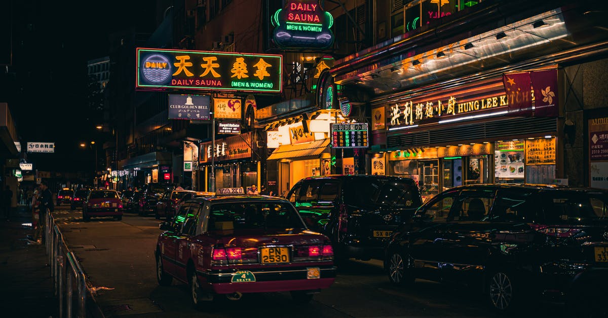 Hong Kong street photography? - Cars Beside Neon Signages