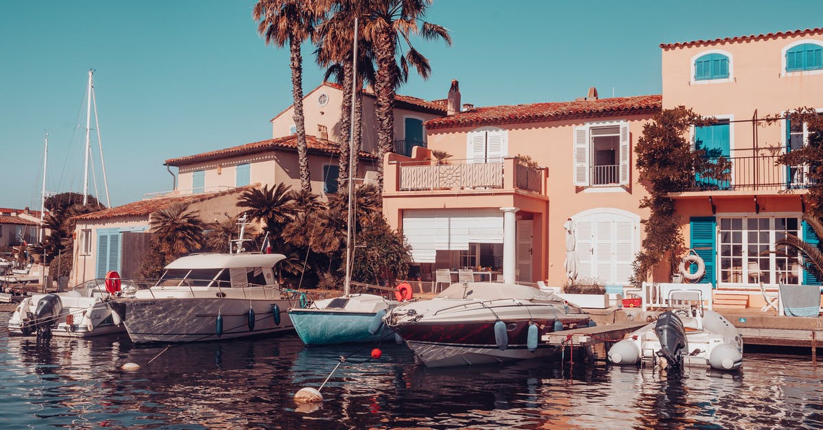 Hotel quarantine in France - Building With Boats Docked Next To It