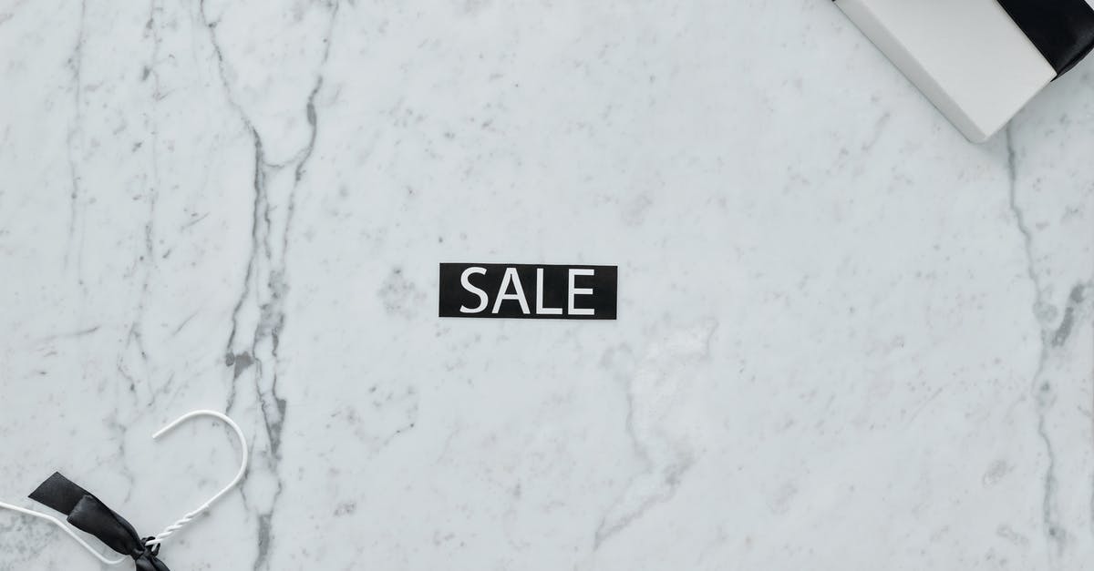 Hotels.com discount [closed] - Close-Up Shot of a Discount Tag on a Marble Surface