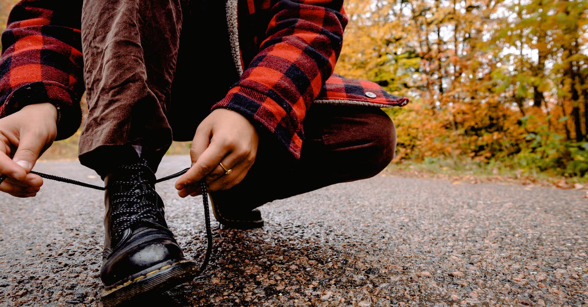 How accessible are the dirt-road parts of Iceland's ring road? - Person Tying Her Shoelaces