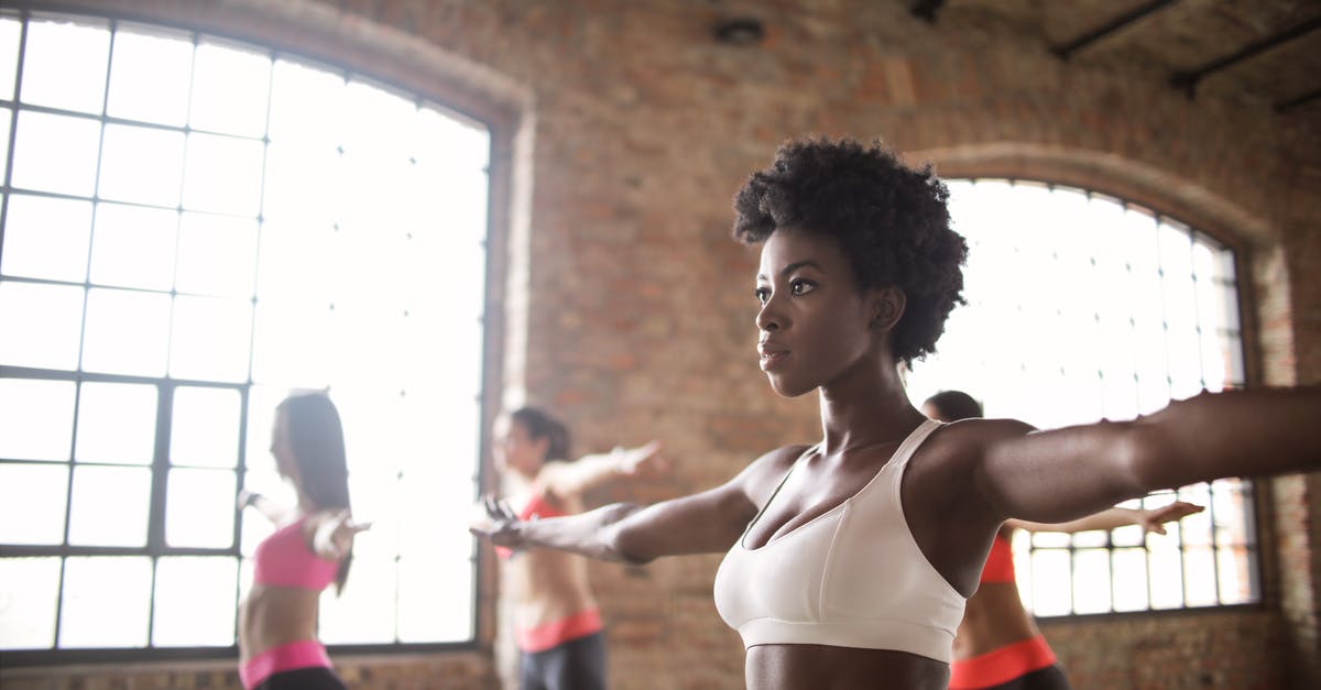 how are boarding groups determined? [duplicate] - Confident fit ethnic woman training with other sportswomen in modern fitness studio