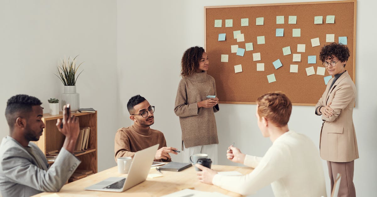 how are boarding groups determined? [duplicate] - Women Standing beside Corkboard