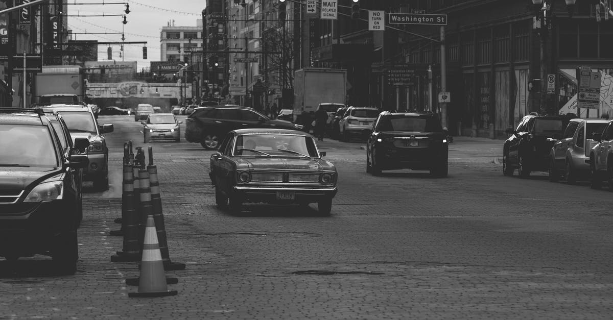 How bad does traffic get between East Hamilton and Oakville, Ontario? - Grayscale Photo of Cars on Road