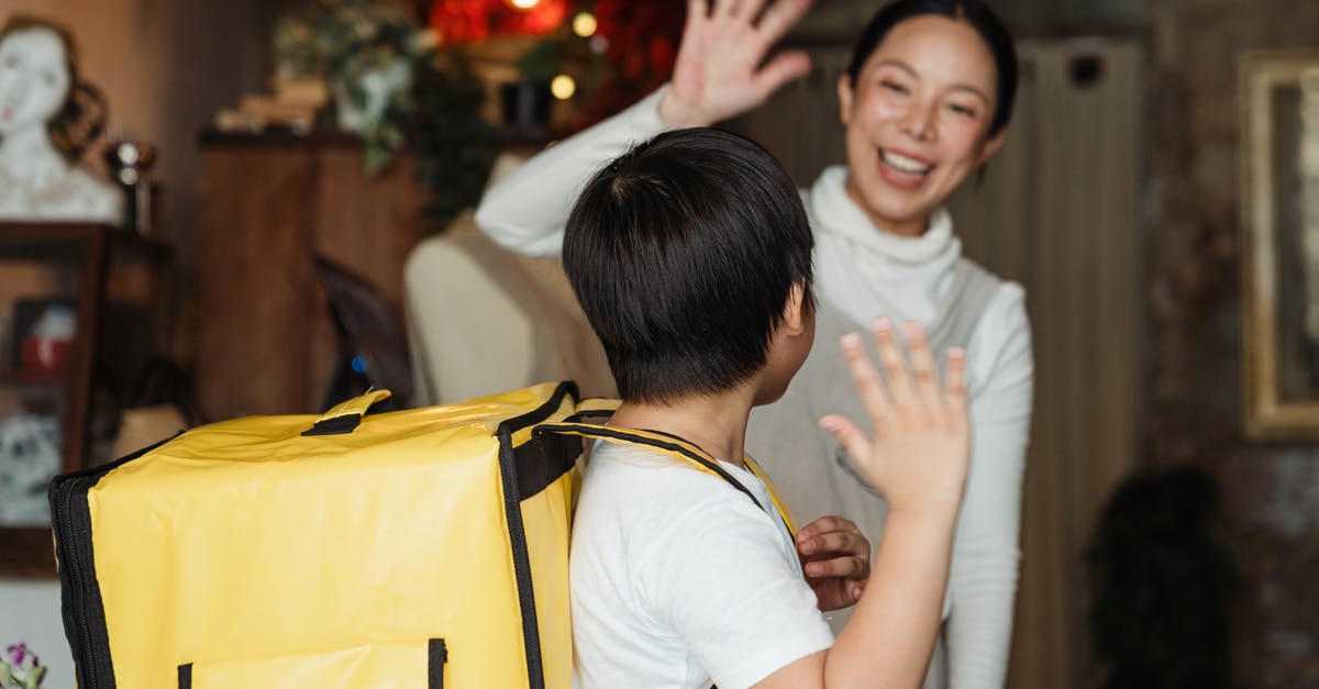 How big of a backpack should I buy? (Trans-Mongolian) - Happy ethnic female cafe worker in apron wishing farewell to boy with food delivery backpack helping in family business