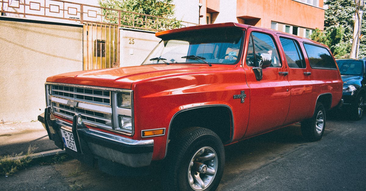 How can I add headlights to a rented car? - Orange Chevrolet Crew Cab Pickup Truck Parked on Road Side