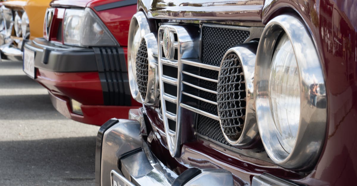 How can I add headlights to a rented car? - Red and Silver Car on Road