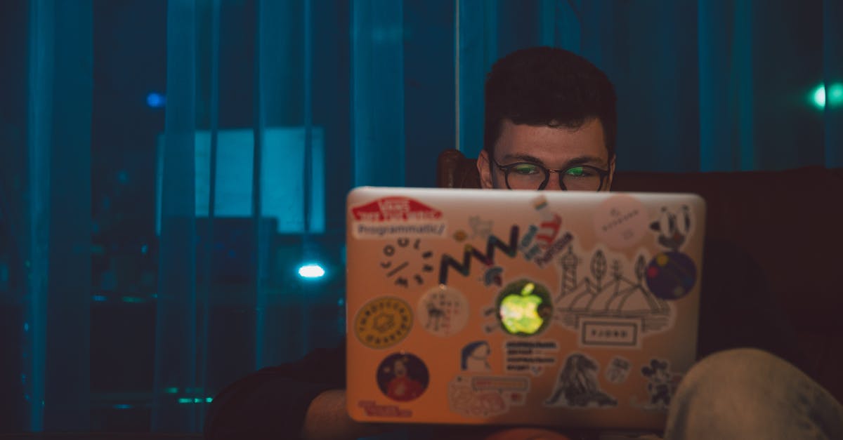 How can I bring a gaming laptop on a airplane handbag? - Photo Of Man Using Laptop