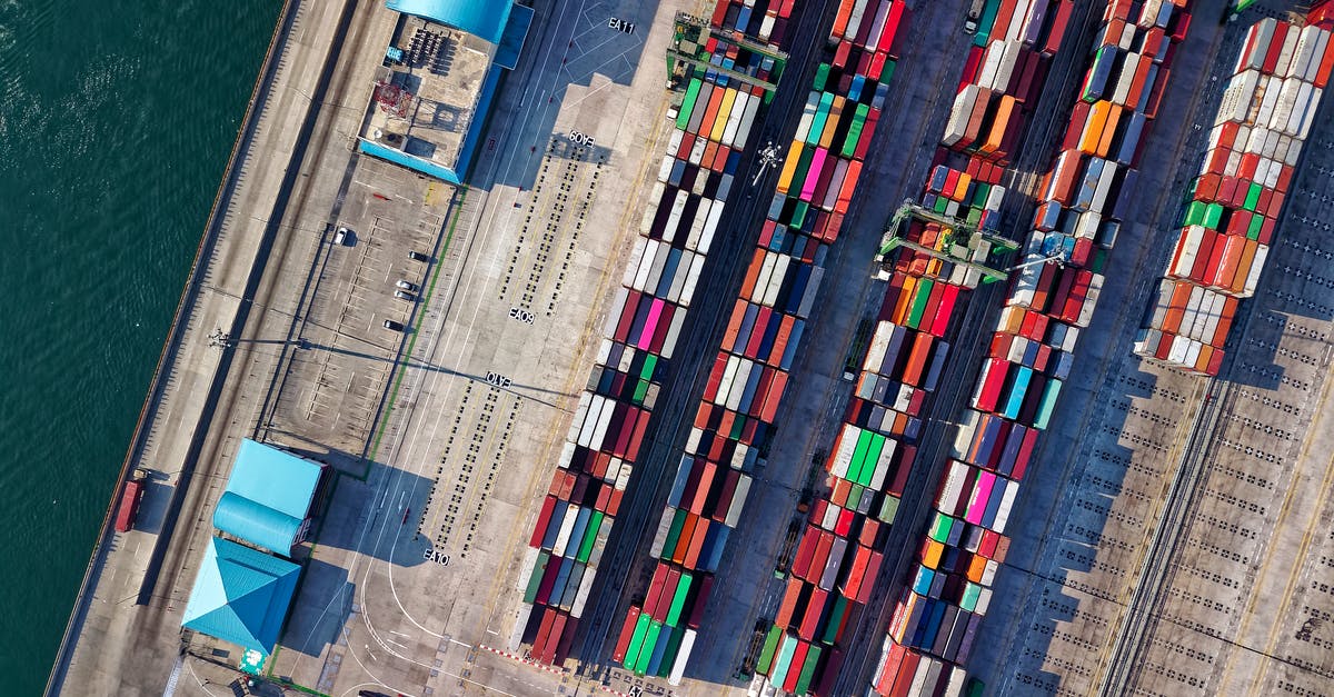 How can I cheaply transport lots of cargo overseas? [closed] - Aerial View Photography of Container Van Lot