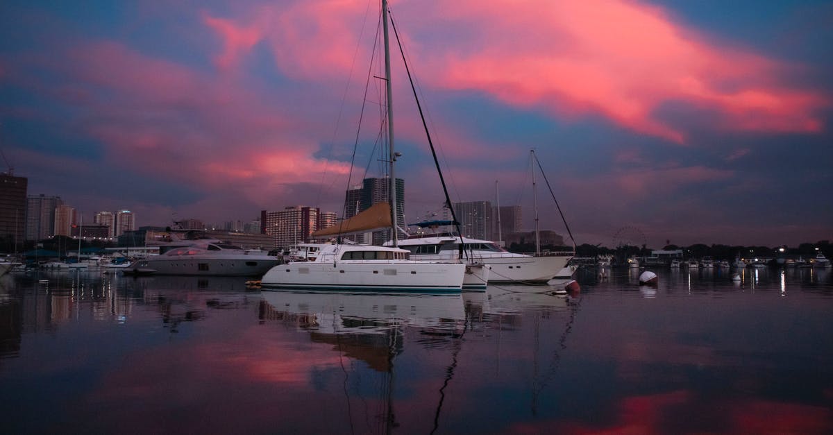 How can I find boats to travel on? - Yachts in Port under Dramatic Sky 