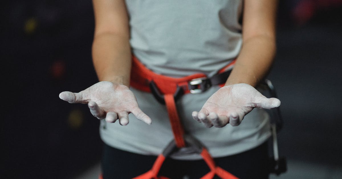 How can I find safety records for extreme sports in New Zealand? - Crop anonymous slender female alpinist with safety harness demonstrating hands in talcum powder before practice How can I find safety records for extreme sports in New Zealand? - Crop anonymous slender female alpinist with safety harness demonstrating hands in talcum powder before practice
