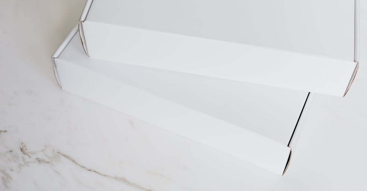 How can I get a postal order or cheque in British Pounds from outside of the UK? - Set of white carton packages on marble surface How can I get a postal order or cheque in British Pounds from outside of the UK? - Set of white carton packages on marble surface