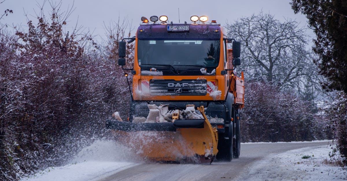 How can I get a reliable taxi/car service in LA? - Yellow and Black Heavy Equipment on Snow Covered Ground