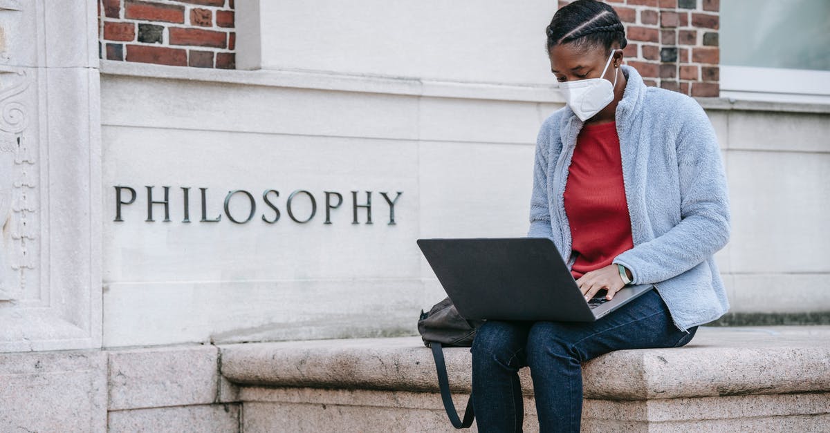 How can I get EU Digital COVID Certificate? - Concentrated young African American female student in casual clothes and medical mask sitting near Philosophy faculty and typing on laptop