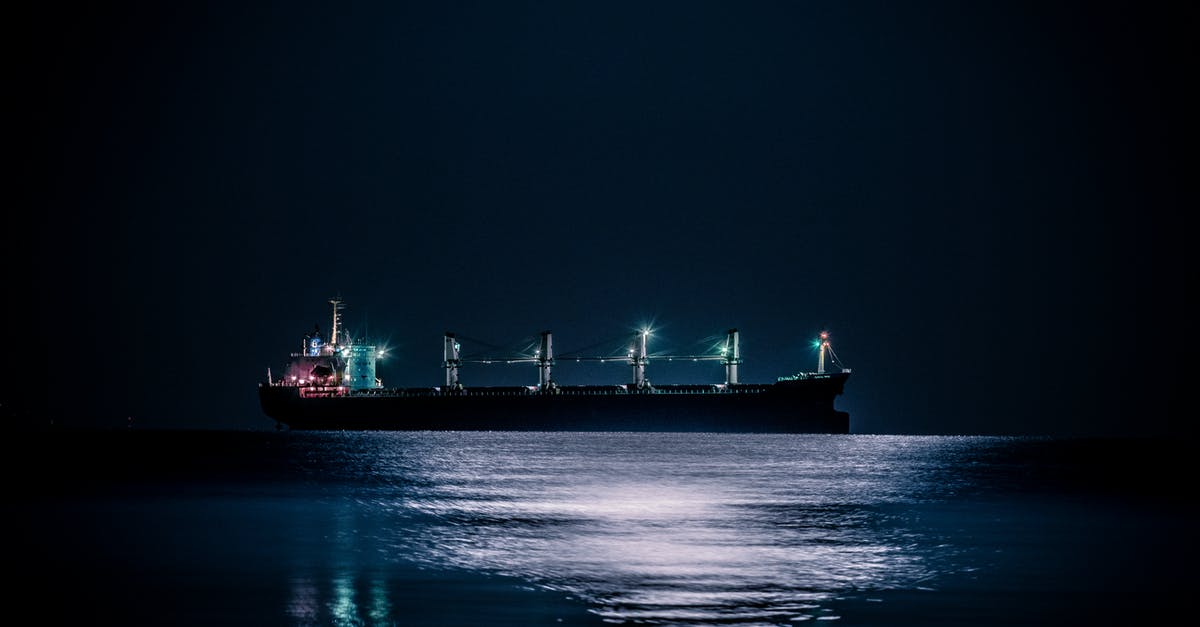 How can I get to Iceland on a cargo ship? - White and Red Cargo Ship on Dock