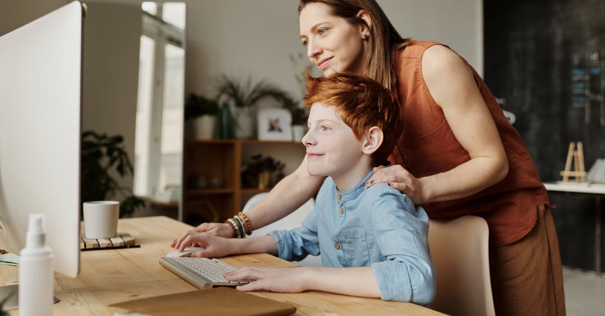 How can I help Japanese speakers using my hard-to-pronounce name? - Photo of Woman Teaching His Son While Smiling