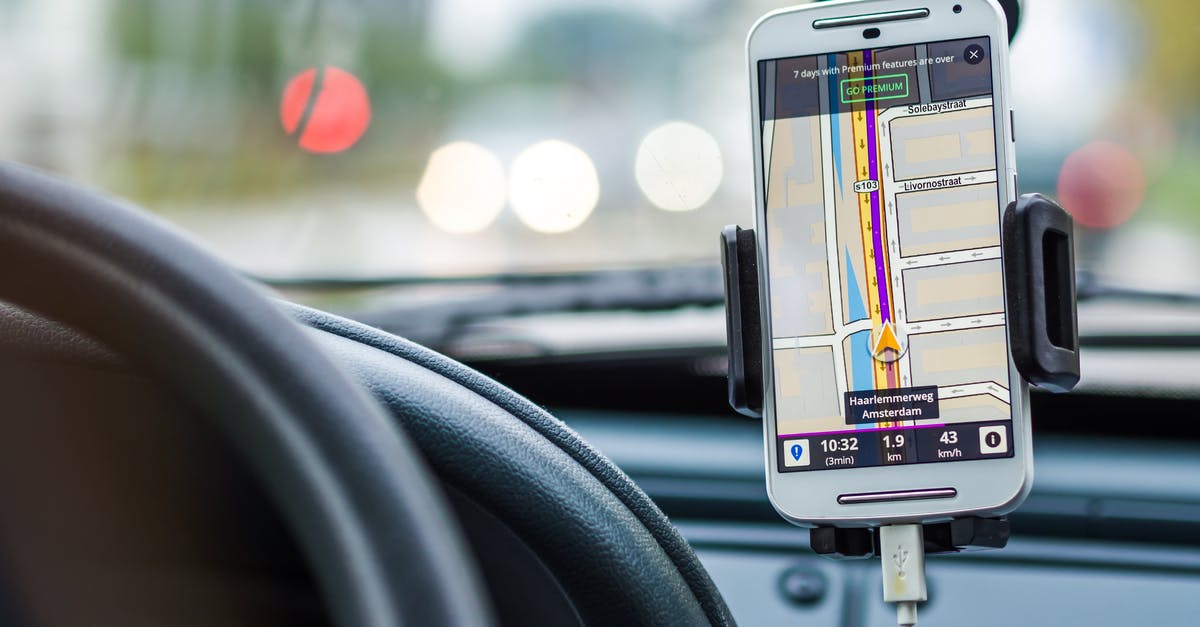 How can I map stations for a driving trip? - White Android Smartphone Inside Vehicle