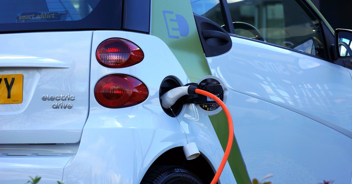 How can I prepare to rent an electric car in France? - White and Orange Gasoline Nozzle