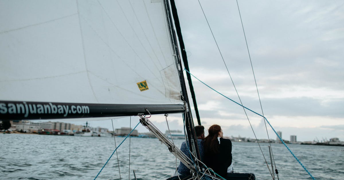 How can I travel between San Juan and Fajardo, Puerto Rico? - A Couple Riding a Yacht while Sailing on Sea