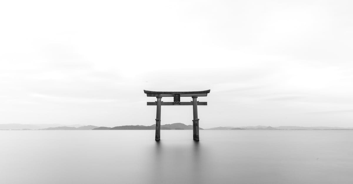 How can I travel to Japan from mainland Asia by ship? - Pagoda in Gray Scale Shot