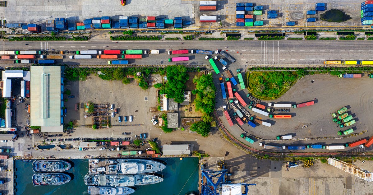 How can Norwegian Customs know who repaired their boats abroad? - High Angle Shot of Colorful Trucks