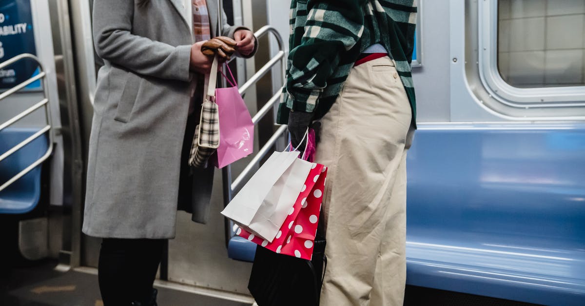 How can you buy train tickets at Oslo Airport? - Crop women riding in subway train