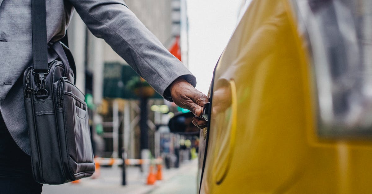 How could a Washington registered car travel to Zürich? - Black man touching door of taxi