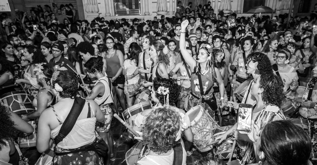 How crowded are Iceland's main sites during summer? - Grayscale Photo of People in a Concert