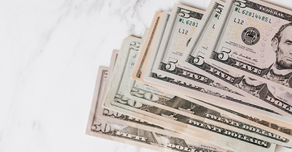 How different are US weigh stations for trucks than Canadian ones? - Different dollar bills on marble surface How different are US weigh stations for trucks than Canadian ones? - Different dollar bills on marble surface