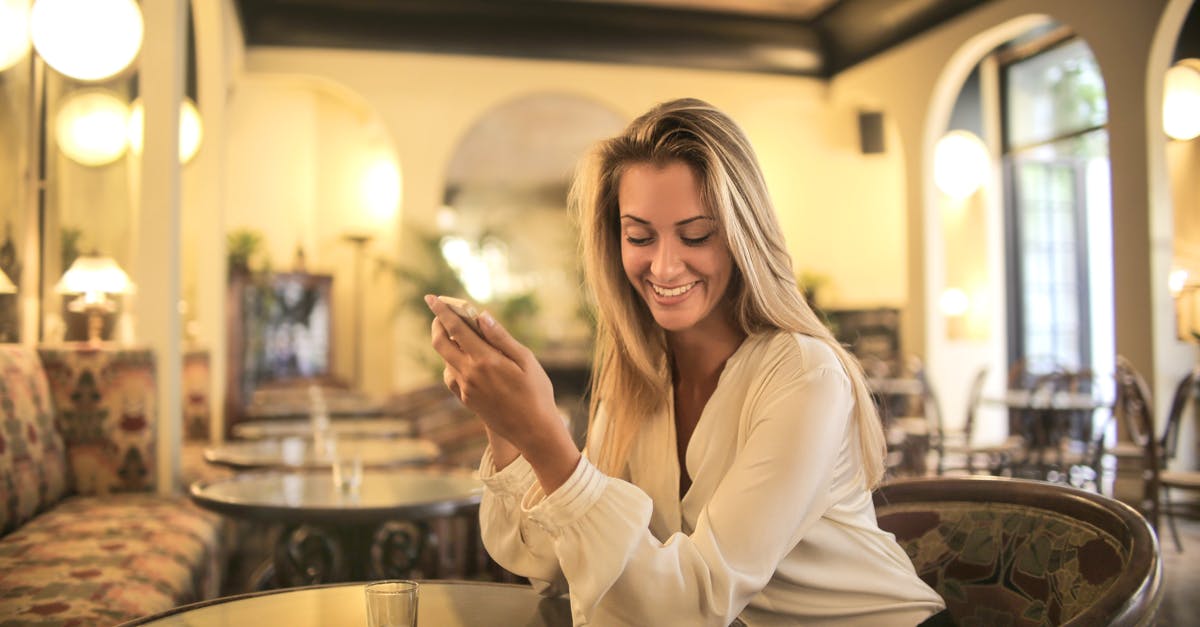 How do hotel housekeepers know if a room is in use? - Cheerful female having drink in elegant bar